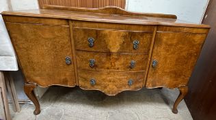 A 20th century Burr Walnut sideboard with three drawers and two cupboards,