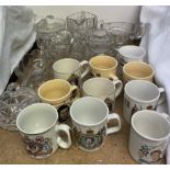 Commemorative mugs together with a glass jug,