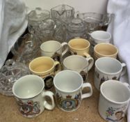 Commemorative mugs together with a glass jug,