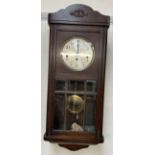 A 20th century oak wall clock,