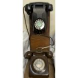 A black bakelite telephone,