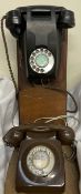 A black bakelite telephone,