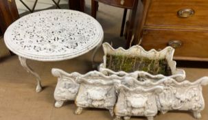 A small white painted metal garden coffee table together with a pair of cast iron sectional
