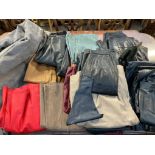 A leather sheet together with an assortment of unbranded belts,