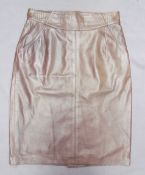 A knee length Burbury leather skirt together with a collection of designer leather trousers and