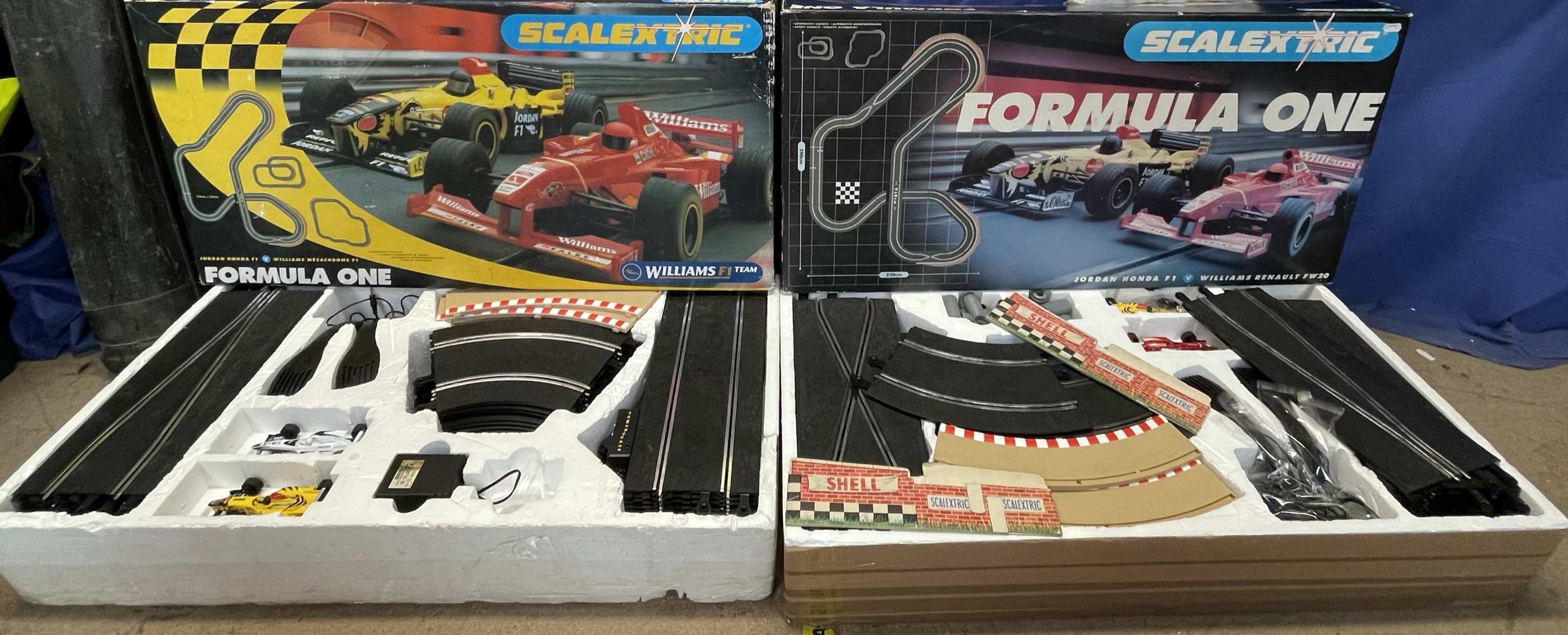 Three Scalextric Formula One sets,