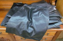 A Caroline Charles knee length leather skirt,