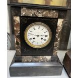 A black slate mantle clock,