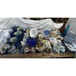 Graduated blue and white jugs together with other jugs, vases, figures, plates,