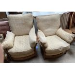 A pair of Ercol upholstered arm chairs,