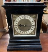 A late 19th century ebonised bracket clock, with a glazed top, front, back and sides,