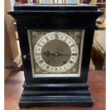 A late 19th century ebonised bracket clock, with a glazed top, front, back and sides,