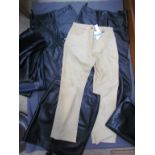 Three pairs of black leather trousers,