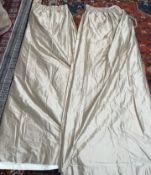 A pair of champagne silk full length curtains,