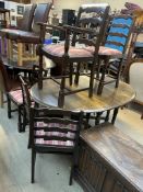 A modern gateleg dining table together with a set of six ladder back dining chairs