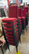 Thirty five plush red upholstered and black steel stacking chairs