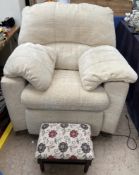 A cream upholstered electric chair together with a foot stool