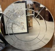 A modern circular wall mirror,