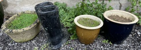 A reconstituted stone planter of circular form,