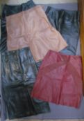 Three leather skirts by Betty Jackson, (a long black, size 10, a knee length dark red and a tan,