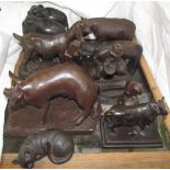 Heredites models of animals together with a cast iron bull, pottery rhinocerous,