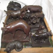 Heredites models of animals together with a cast iron bull, pottery rhinocerous,