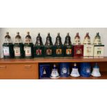 A collection of Bell's Old Scotch Whisky Christmas Decanters for 1989 - 1998 together with a