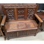 A 20th century oak settle,