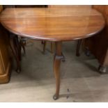 A 19th century mahogany gateleg dining table with an oval top on cabriole legs and pad feet