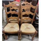 A set of four modern ladder back dining chairs with rush seats