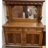An Edwardian oak mirrorback sideboard with a moulded cornice and pillars,
