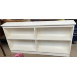 A white painted bookcase