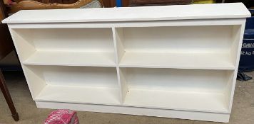 A white painted bookcase