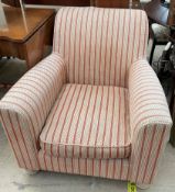 A Victorian style upholstered elbow chair with red and cream upholstery