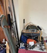 Assorted fishing equipment including rods, reels,