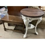 A cast iron pub table, with a circular top,