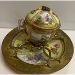 A Meissen style desk ink well, the domed lid with panels of flowers and figures to a yellow ground,