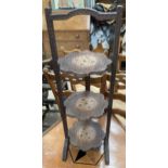 An Anglo Indian carved and brass inlaid folding cake stand