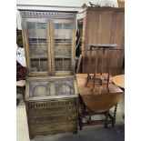 A 20th century oak bureau bookcase together with an oak gateleg dining table and a carved