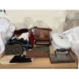 A crocodile skin handbag together with a collection of clutch bags, linen,