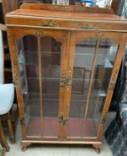 A 20th century walnut chinoiserie decorated display cabinet,