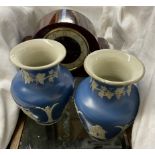 A pair of Jasper ware vases decorated with figures together with a mahogany mantle clock