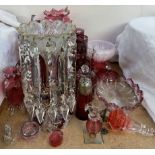 A flash glass table lustre together with a pair of cranberry glass lustres, another lustre,