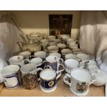 A collection of modern commemorative mugs factories including Wedgwood, Aynsley, Royal Worcester,