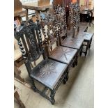 A set of six 17th century style carved oak dining chairs with leaf carved cresting rails and
