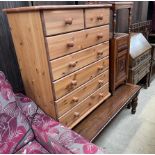 A 20th century oak bureau, together with a walnut bedside cabinet,