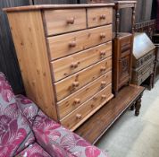 A 20th century oak bureau, together with a walnut bedside cabinet,