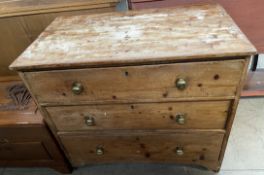 A Victorian pine chest with a rectangular top above three long drawers on bracket feet