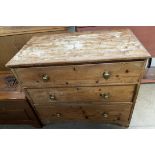 A Victorian pine chest with a rectangular top above three long drawers on bracket feet