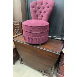 A 20th century oak gateleg dining table together with an upholstered tub chair